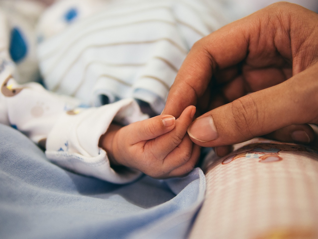 baby and mom hands