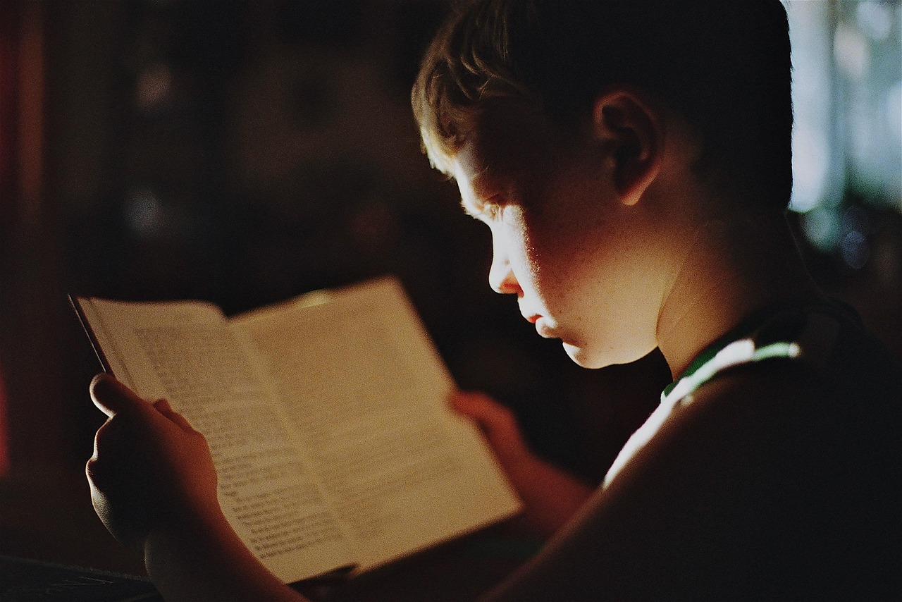 young boy reading