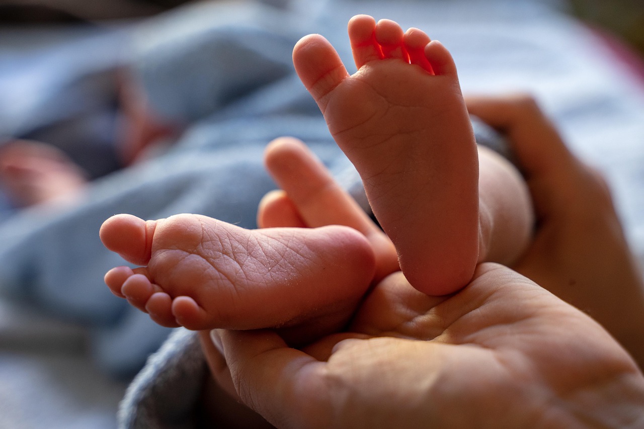 holding baby feet